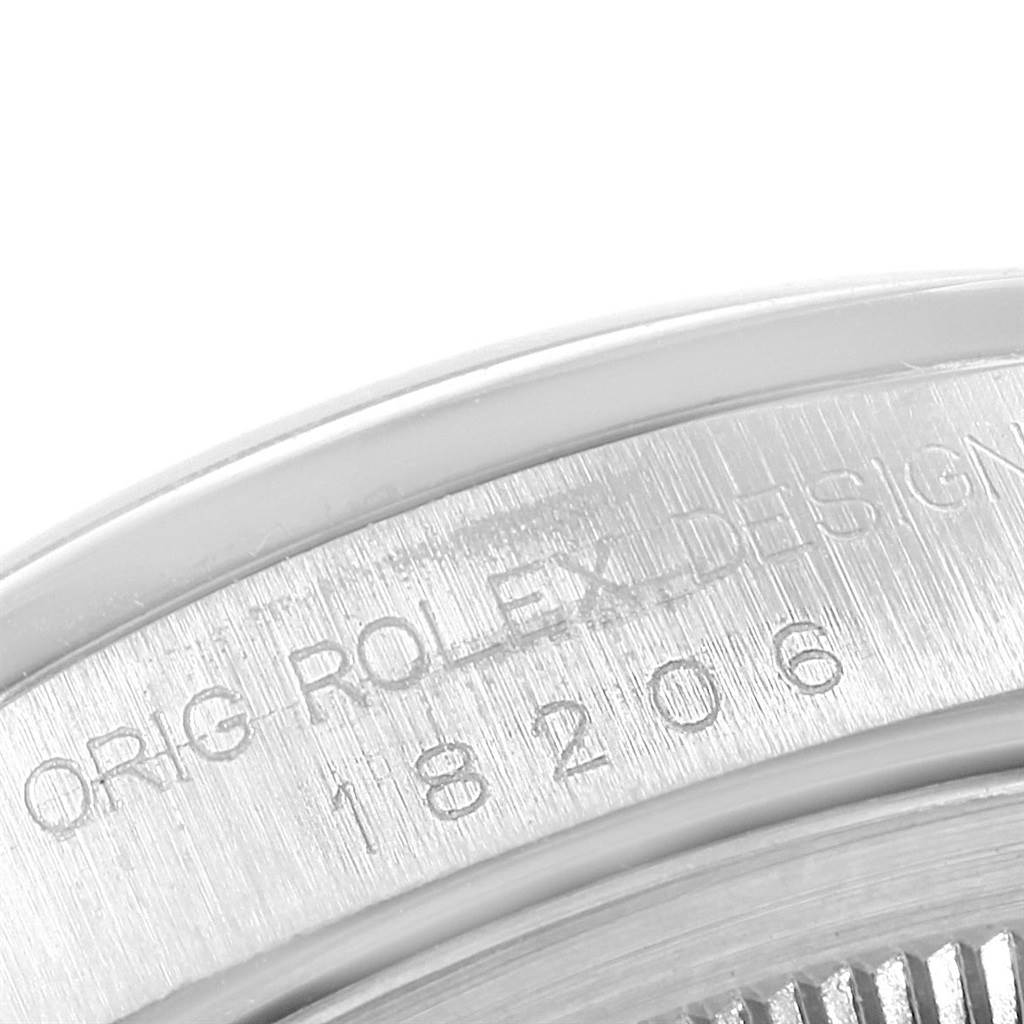 The image shows an angled close-up of the case back of a Rolex President 18206 Men's Platinum Blue Dial 18206 Men's Platinum Blue Dial model with visible engravings.