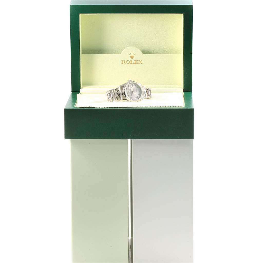 The Rolex President 118239 Men's White Gold Grey Dial 118239 Men's White Gold Grey Dial model watch is displayed front-on in an open green and cream box.