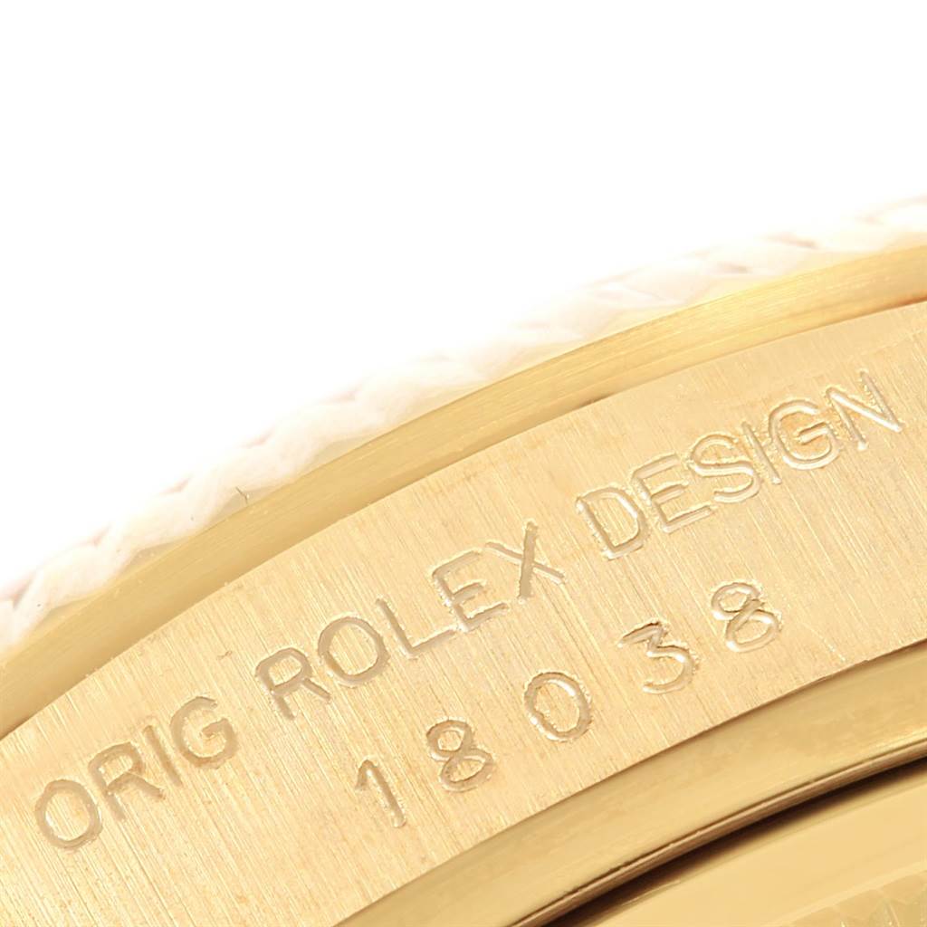 The image shows a close-up of the side engraving on the bezel of a Rolex President 18038 Men's Yellow Gold Champagne Dial 18038 Men's Yellow Gold Champagne Dial model watch.
