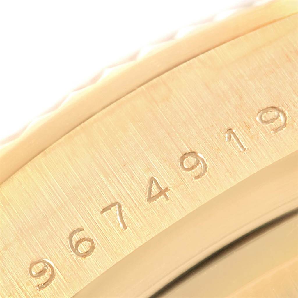 Close-up of the Rolex President 18038 Men's Yellow Gold Champagne Dial 18038 Men's Yellow Gold Champagne Dial watch showing its engraved serial number on the case.