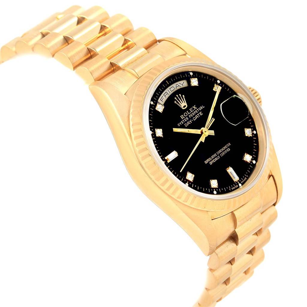 The angle shows the President model Rolex watch from a slightly elevated side perspective, displaying its black dial, gold case, and bracelet.