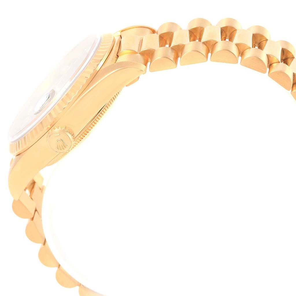 This image shows a side view of the Rolex President 18238 Men's Yellow Gold Black Dial 18238 Men's Yellow Gold Black Dial model watch, focusing on the case and part of the bracelet.