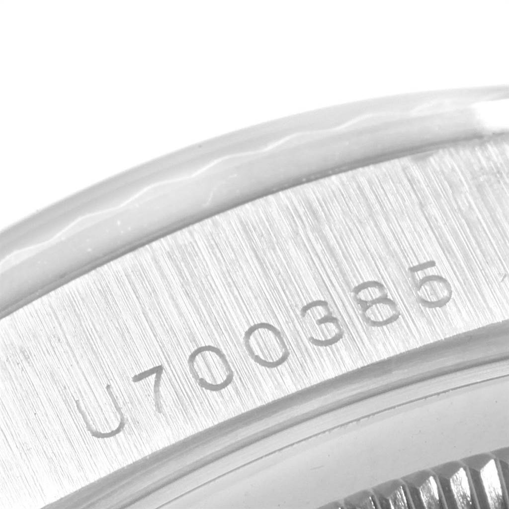 The image shows a close-up of the serial number on the case back of a Rolex President 18239 Men's White Gold Pink Dial 18239 Men's White Gold Pink Dial model.