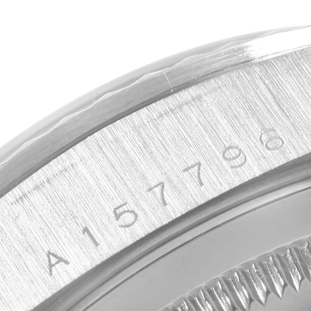 This close-up image shows the engraved serial number on the case of a Rolex President 18239 Men's White Gold Silver Dial 18239 Men's White Gold Silver Dial model watch.