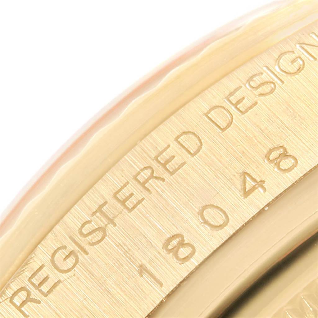 The close-up image shows the outer ring (bezel) and the serial number engraving of the Rolex President 18048 Men's Yellow Gold Black Dial 18048 Men's Yellow Gold Black Dial model watch.