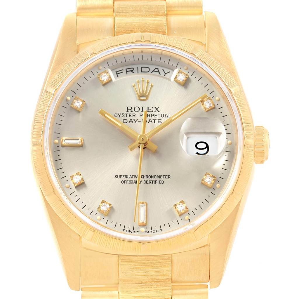The image shows the face of a Rolex President 18248 Men's Yellow Gold Silver Dial 18248 Men's Yellow Gold Silver Dial model watch, highlighting the dial, day and date windows, and part of the bracelet.