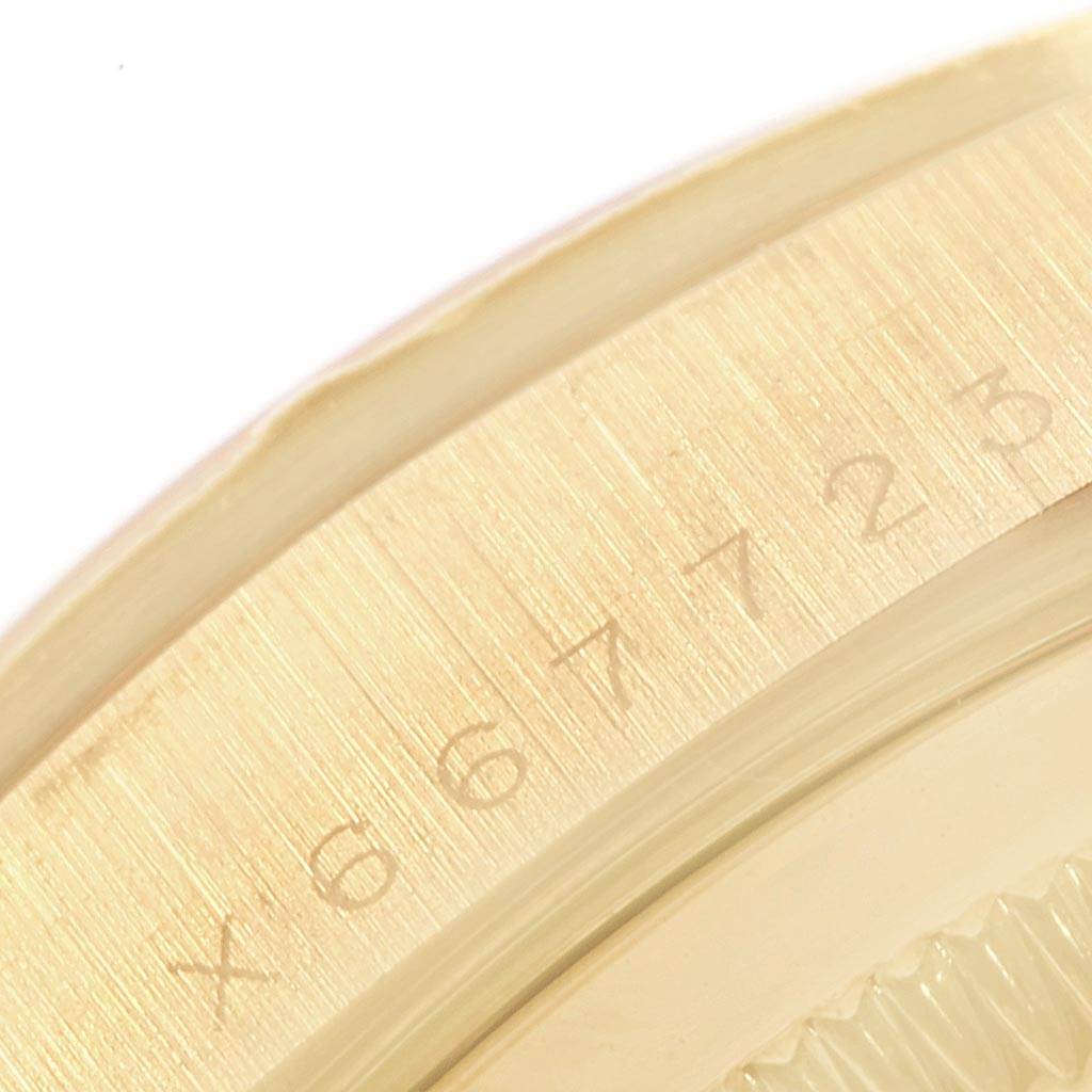 This image shows a close-up of the bezel and serial number engraving on the Rolex President 18248 Men's Yellow Gold Silver Dial 18248 Men's Yellow Gold Silver Dial model watch.