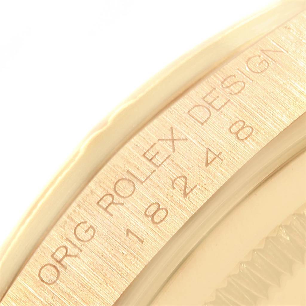 The image shows a close-up angle of the Rolex President 18248 Men's Yellow Gold Silver Dial 18248 Men's Yellow Gold Silver Dial model's engraved bezel or case edge with the design number.