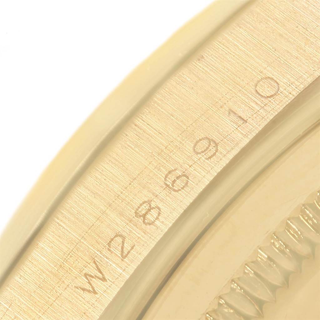 This image shows a close-up of the bezel and serial number on the Rolex President 18248 Men's Yellow Gold Champagne Dial 18248 Men's Yellow Gold Champagne Dial model watch.