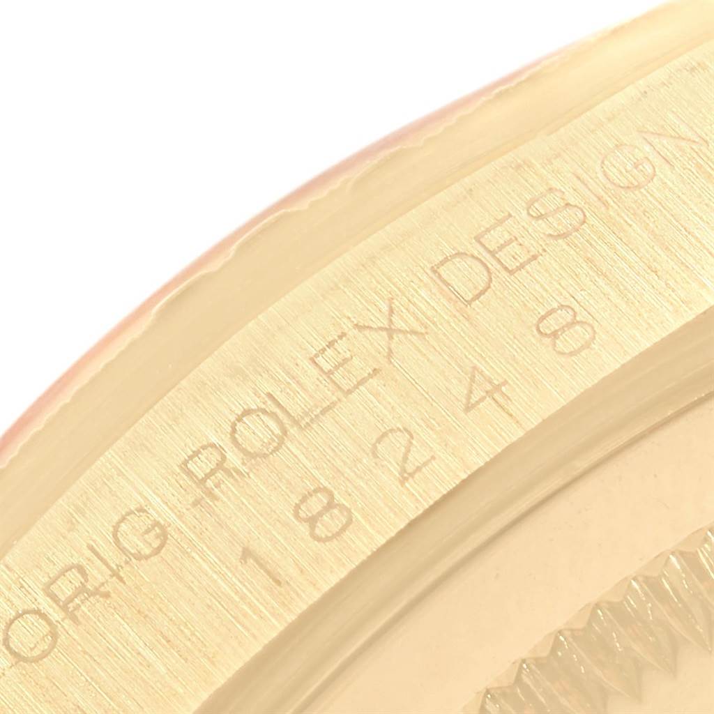 The image shows a close-up of the side engraving on the bezel of a Rolex President 18248 Men's Yellow Gold Champagne Dial 18248 Men's Yellow Gold Champagne Dial model watch.