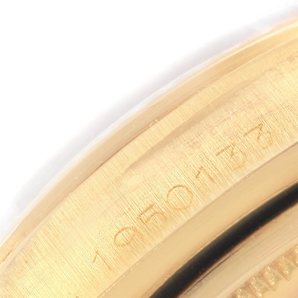 This image shows a close-up of the edge and part of the serial number of the Rolex President 1803 Men's Yellow Gold Champagne Dial 1803 Men's Yellow Gold Champagne Dial model watch.