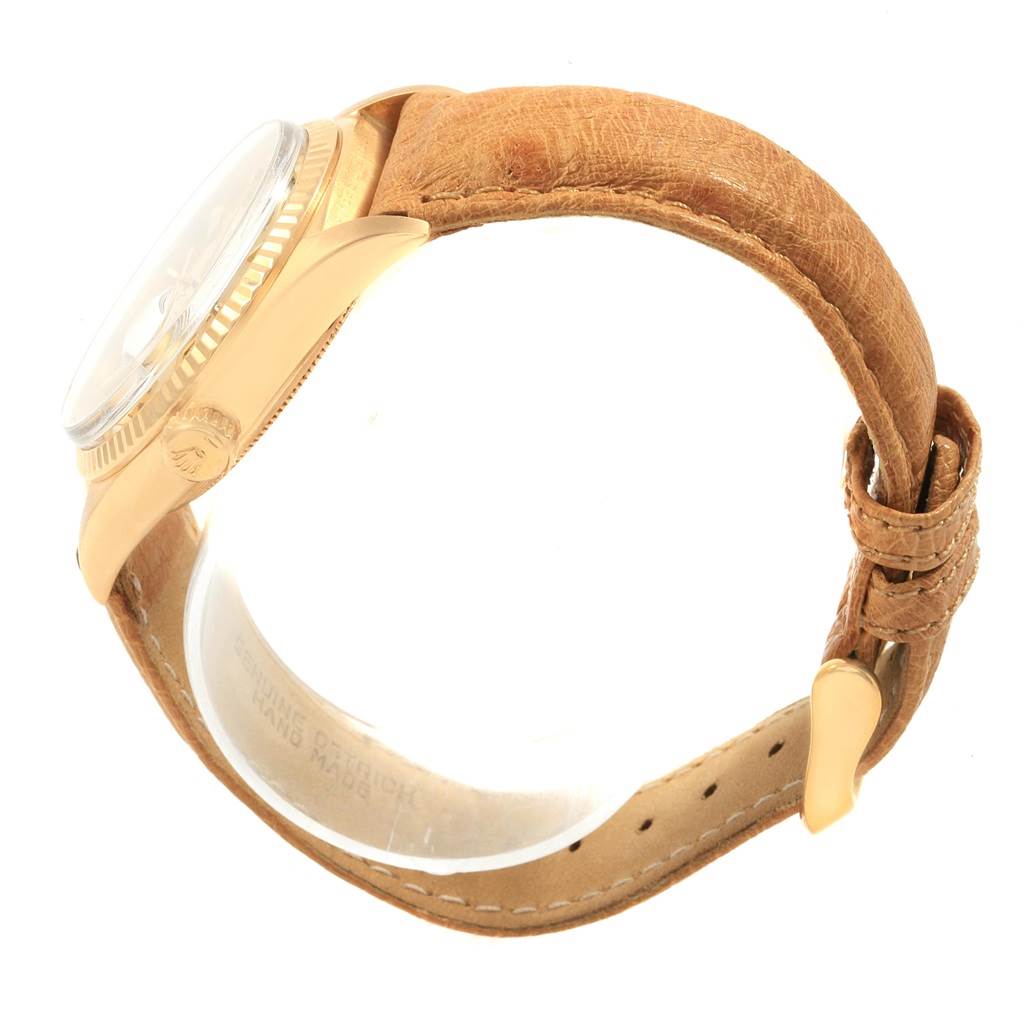 The image shows a side view of a Rolex President 1803 Men's Yellow Gold Champagne Dial 1803 Men's Yellow Gold Champagne Dial model watch, highlighting its tan leather strap and gold case.