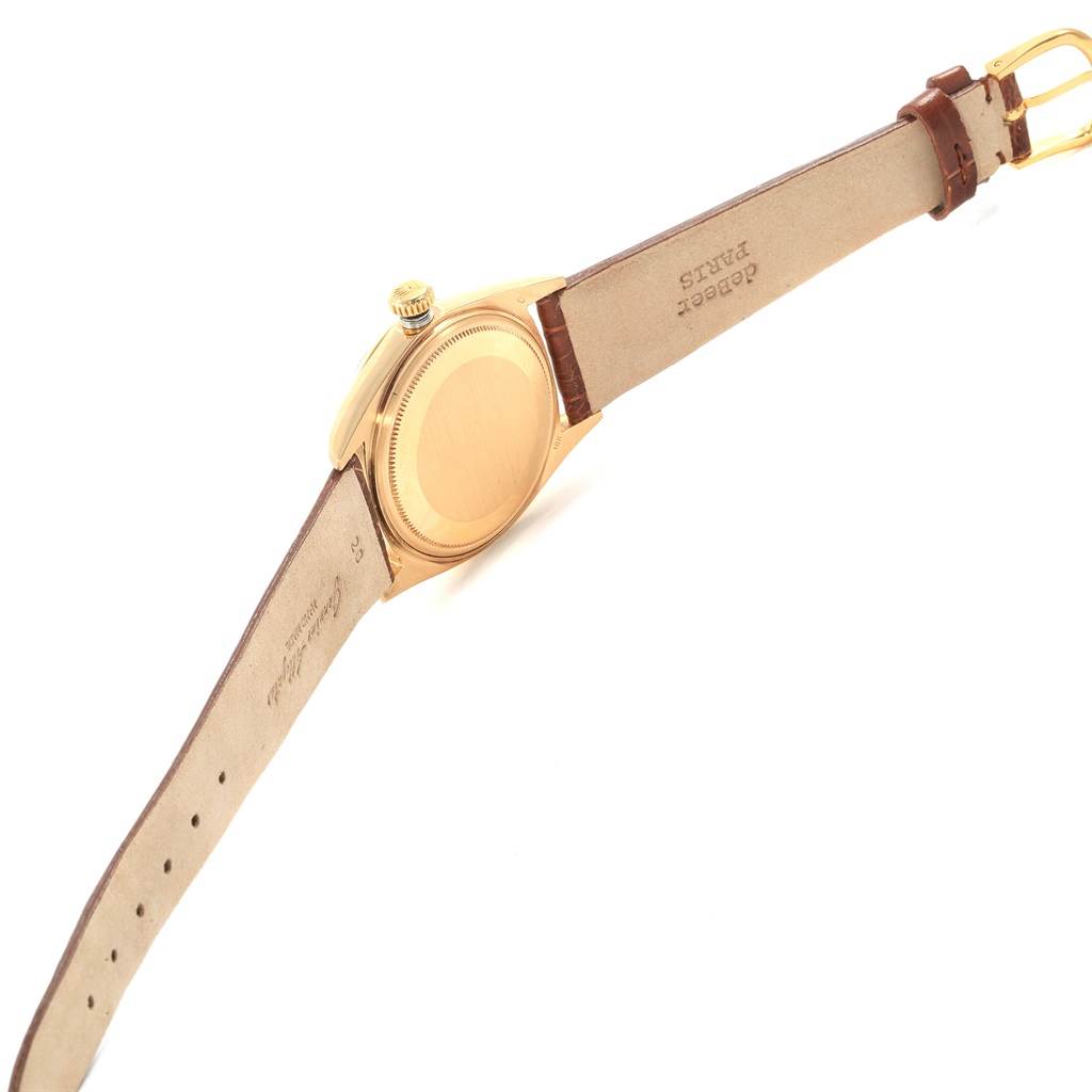 This image shows the back and side of a Rolex President 1803 Men's Yellow Gold Champagne Dial 1803 Men's Yellow Gold Champagne Dial model watch, featuring its gold case and leather strap.