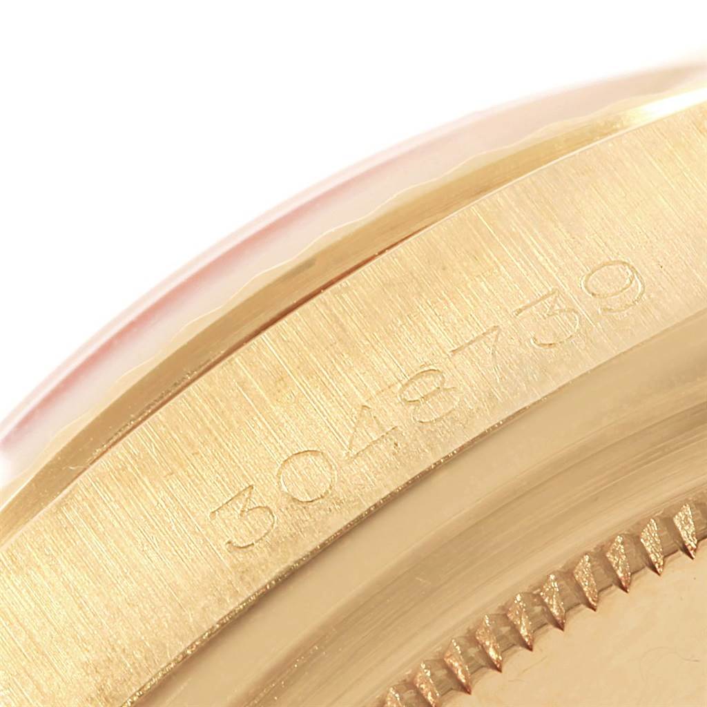 This close-up image shows the serial number engraved on the side of the case of a Rolex President 1803 Men's Yellow Gold Champagne Dial 1803 Men's Yellow Gold Champagne Dial model watch.