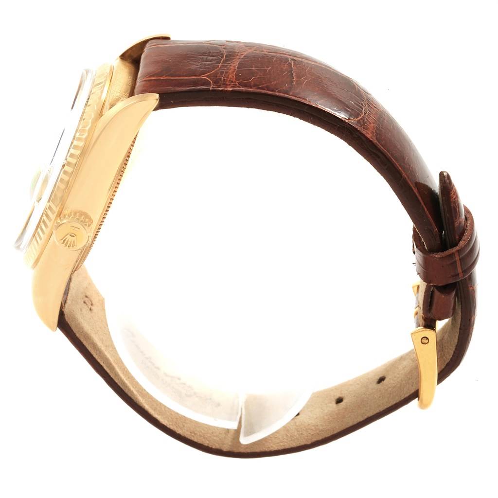 This image shows the side view of a Rolex President 1803 Men's Yellow Gold Champagne Dial 1803 Men's Yellow Gold Champagne Dial model watch with a brown leather strap.