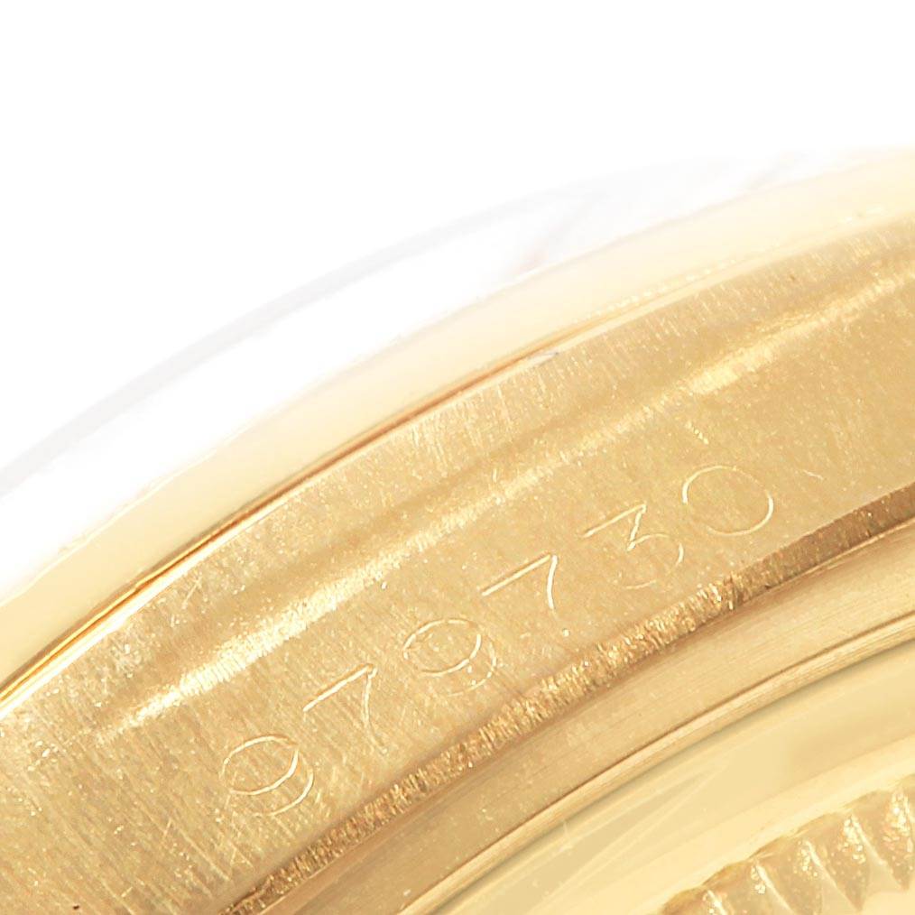 The image shows a close-up angle of the engraved serial number on the gold casing of a Rolex President 1807 Men
s Yellow Gold Champagne Dial 1807 Men
s Yellow Gold Champagne Dial model watch.