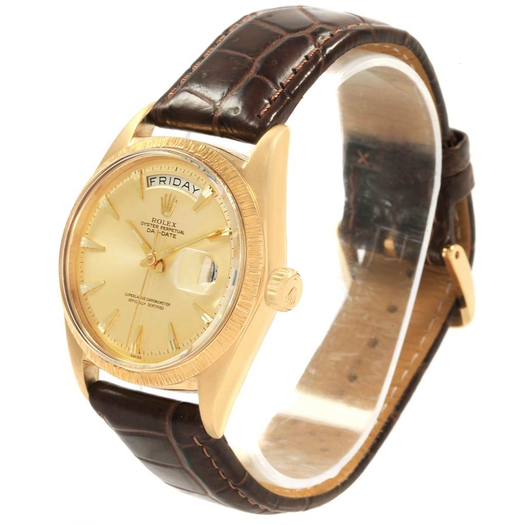 The Rolex President 1807 Men
s Yellow Gold Champagne Dial 1807 Men
s Yellow Gold Champagne Dial model watch is shown at a side angle, displaying its gold case, dial with day-date feature, and brown leather strap.