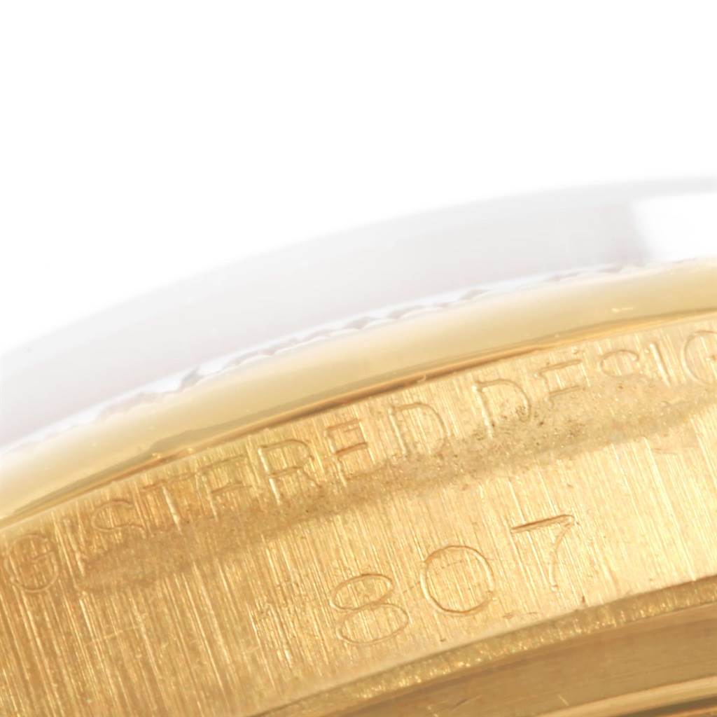 This close-up image shows the engraved side of the Rolex President 1807 Men
s Yellow Gold Champagne Dial 1807 Men
s Yellow Gold Champagne Dial model watch case.