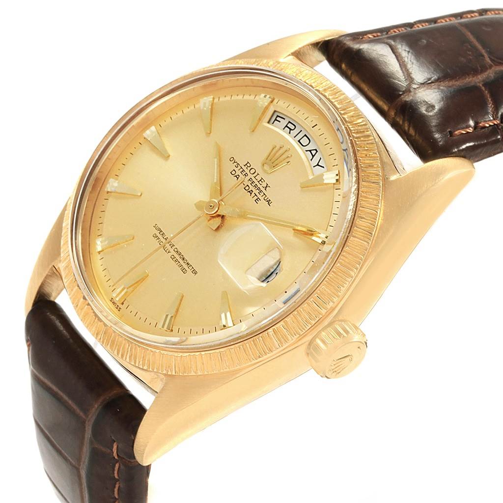 This image shows a Rolex President 1807 Men
s Yellow Gold Champagne Dial 1807 Men
s Yellow Gold Champagne Dial model watch at an angled close-up, highlighting the dial, crown, and part of the leather strap.