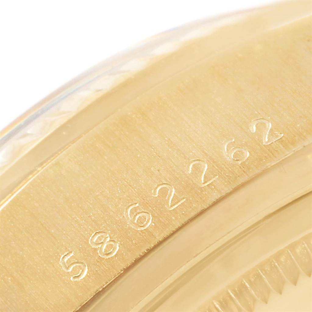 The image shows a close-up of the case serial number on a Rolex President 18078 Men
s Yellow Gold Black Dial 18078 Men
s Yellow Gold Black Dial model watch.