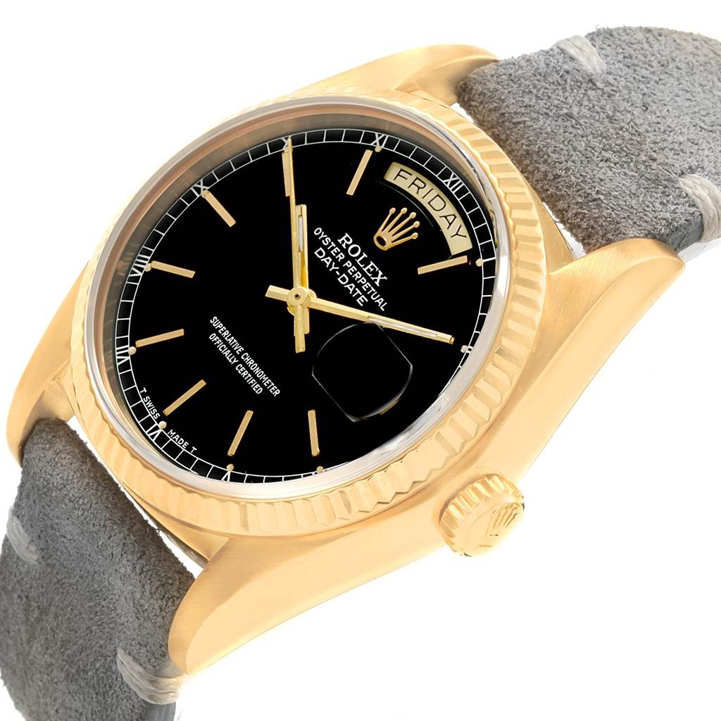 The image shows a close-up angle of the Rolex President 18078 Men
s Yellow Gold Black Dial 18078 Men
s Yellow Gold Black Dial model watch, highlighting its face, bezel, crown, and part of the strap.