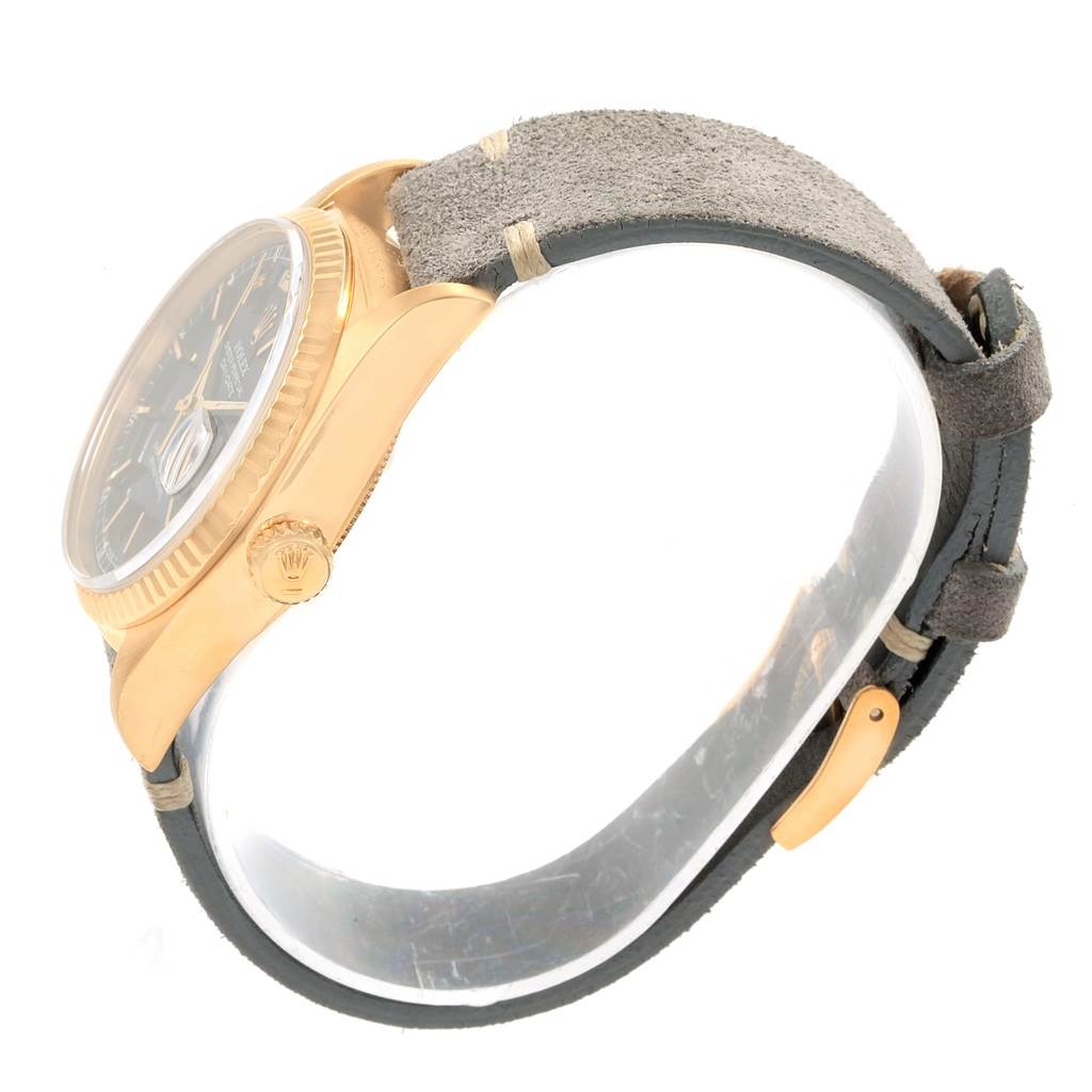 This image shows a side view of the Rolex President 18078 Men
s Yellow Gold Black Dial 18078 Men
s Yellow Gold Black Dial watch, highlighting the crown, bezel, case, and strap in detail.