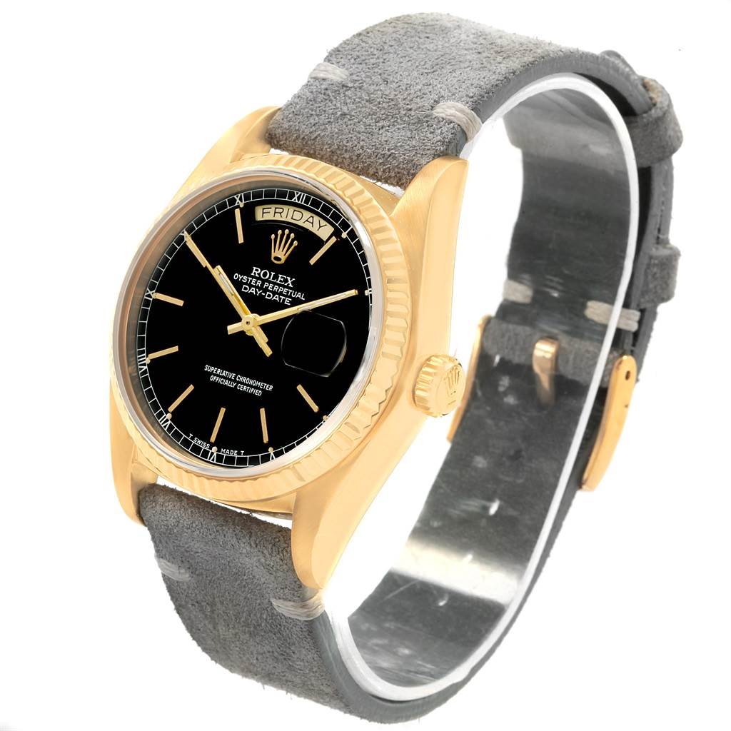 This image shows a Rolex President 18078 Men
s Yellow Gold Black Dial 18078 Men
s Yellow Gold Black Dial model watch from an angled view, highlighting its face, bezel, crown, and strap.