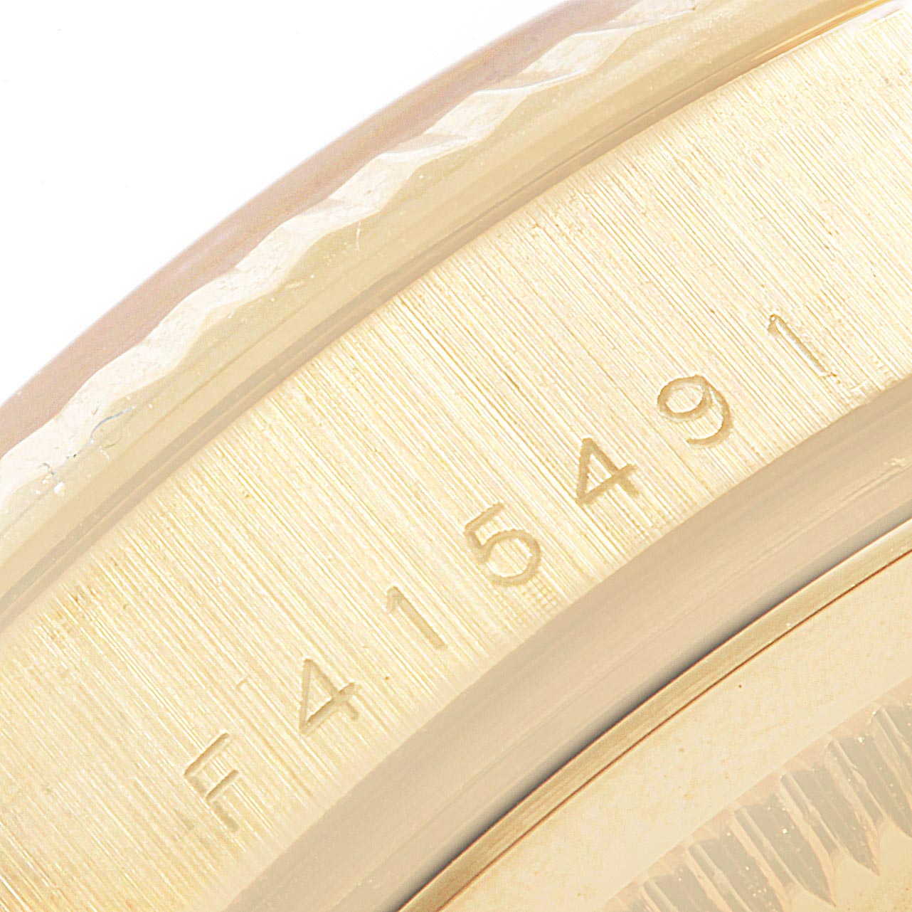 This image shows the serial number engraving on the side of the Rolex President 118238 Men
s Yellow Gold White Dial 118238 Men
s Yellow Gold White Dial model watch case.
