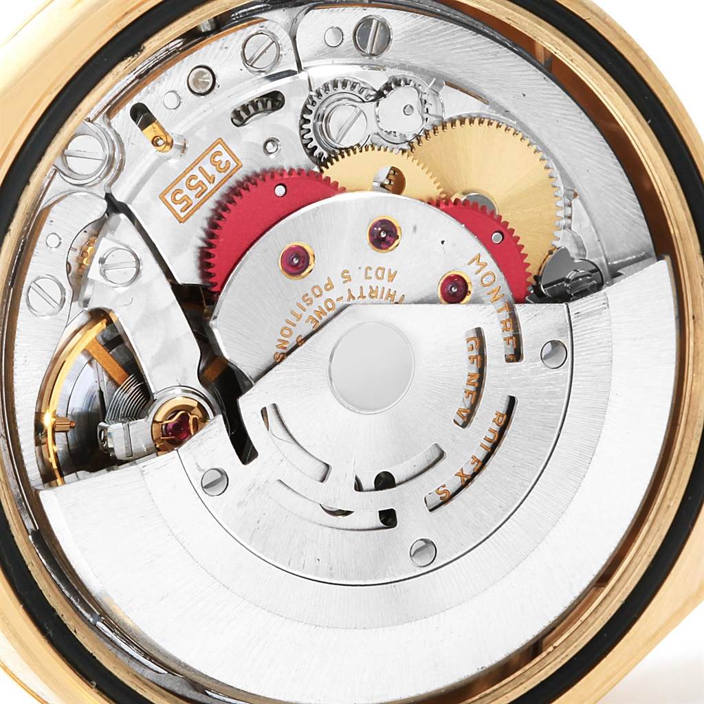 This image shows the intricate internal movement and gears of a Rolex President 118238 Men
s Yellow Gold White Dial 118238 Men
s Yellow Gold White Dial model watch, viewed from the case back.