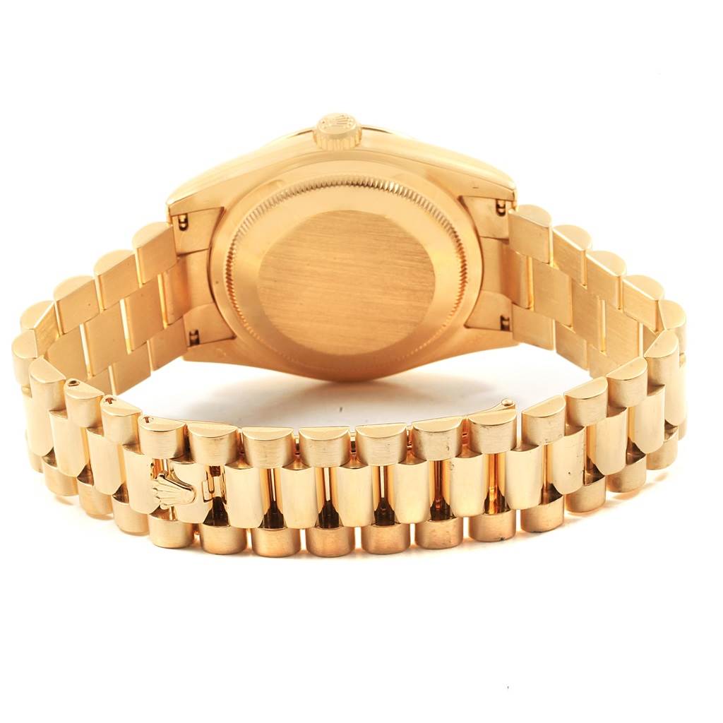 The image shows the back view and bracelet of a Rolex President 118238 Men
s Yellow Gold White Dial 118238 Men
s Yellow Gold White Dial model watch.