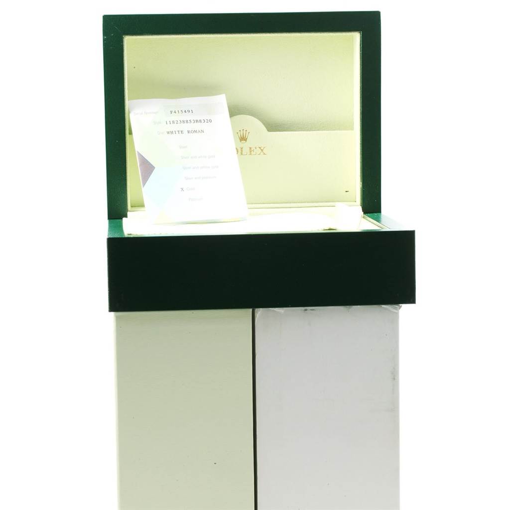 The image shows a Rolex President 118238 Men
s Yellow Gold White Dial 118238 Men
s Yellow Gold White Dial model watch box, open, with some documents inside.