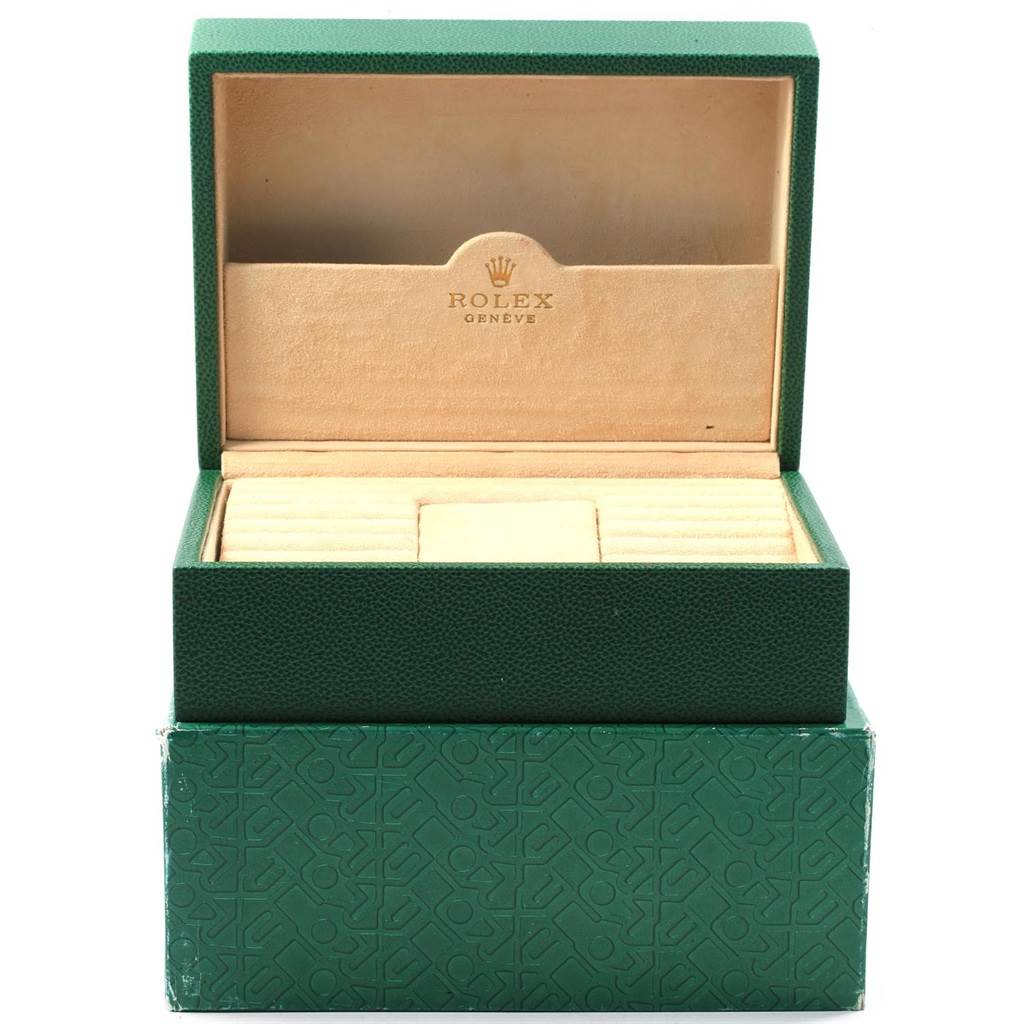 This is an open green Rolex watch box for the President model, showing the interior compartments.