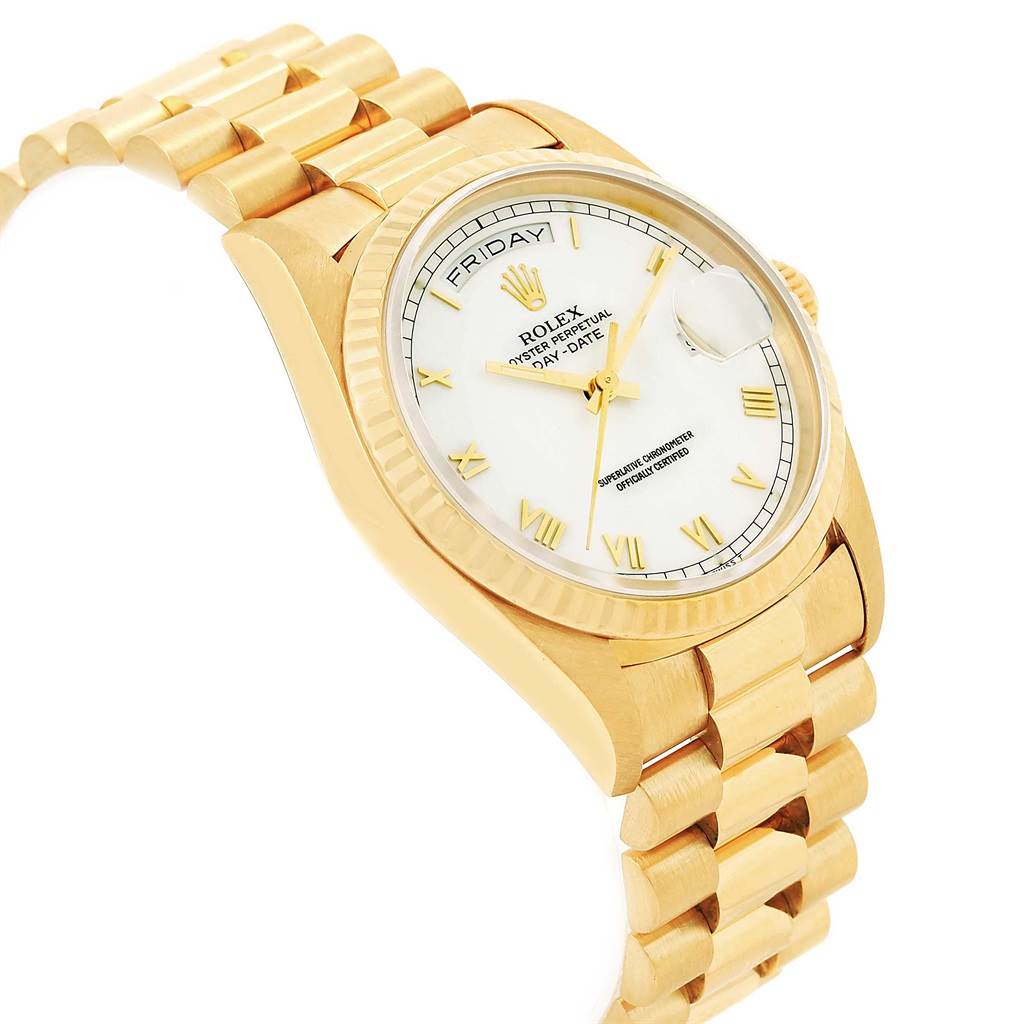 The image shows a Rolex President 18238 Men
s Yellow Gold White Dial 18238 Men
s Yellow Gold White Dial model watch at an oblique angle, highlighting its gold bracelet, white dial, and day-date function.