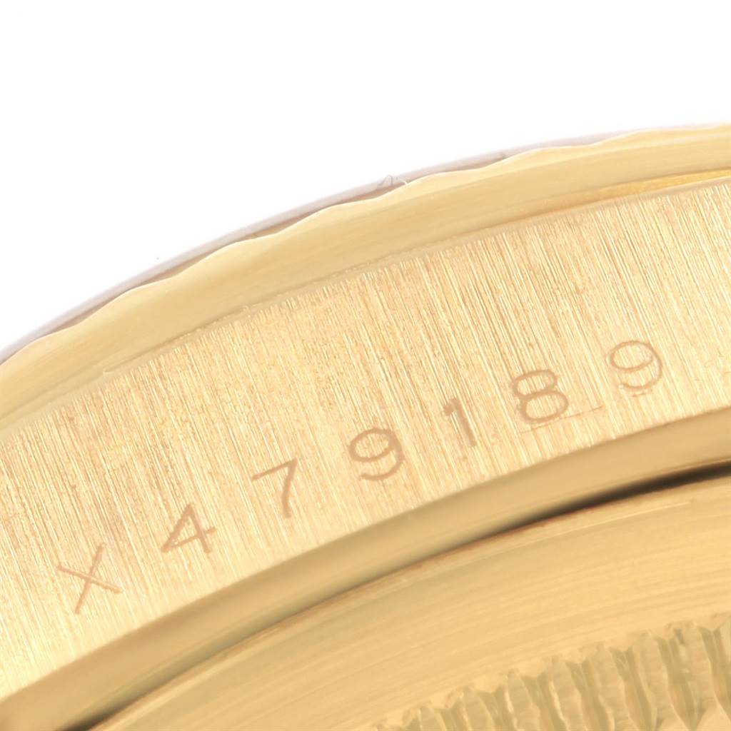 This is a close-up of the case back and serial number engraving on a Rolex President 18238 Men
s Yellow Gold White Dial 18238 Men
s Yellow Gold White Dial model watch.