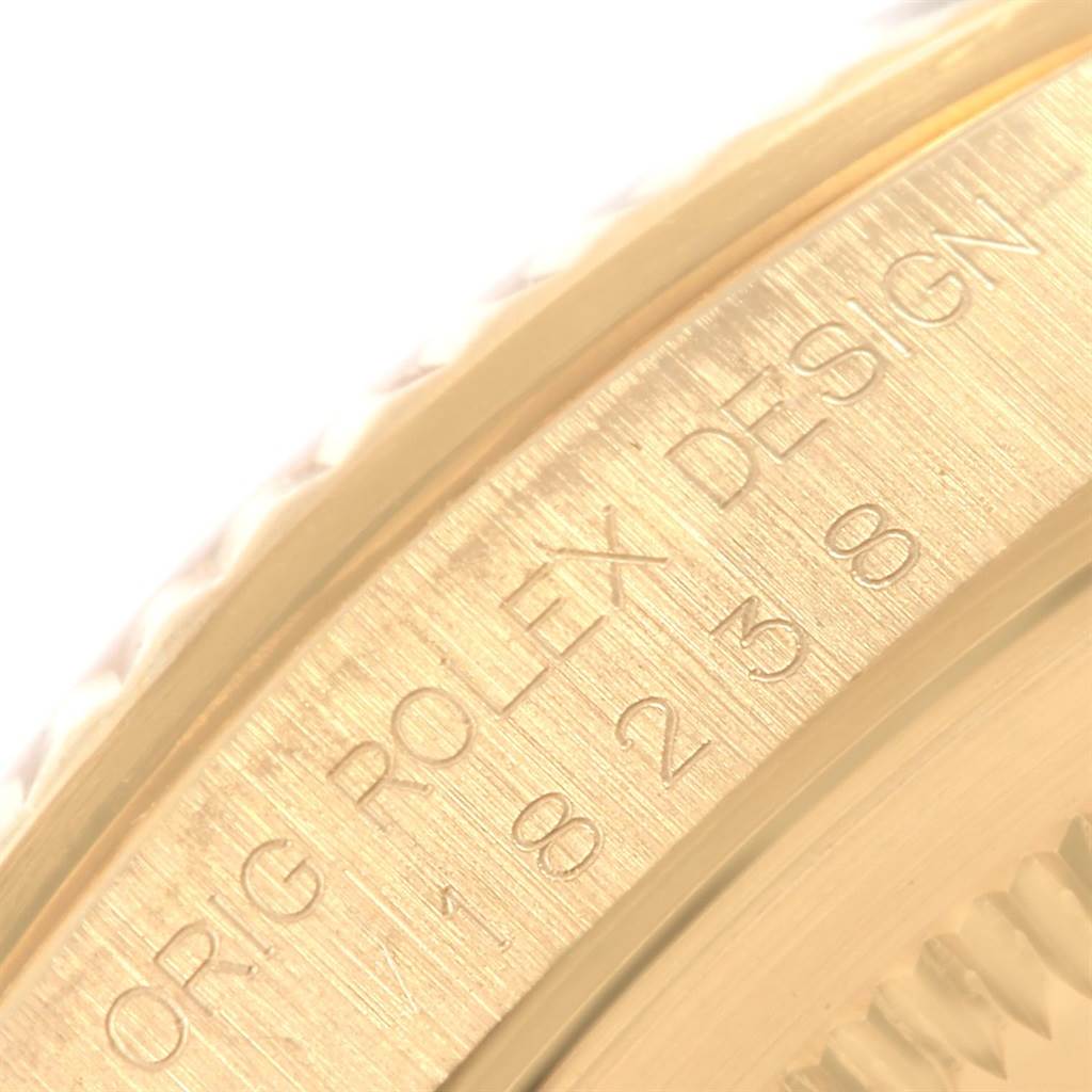 This close-up image shows the engraved side of a President model Rolex watch, highlighting the intricate details and text.