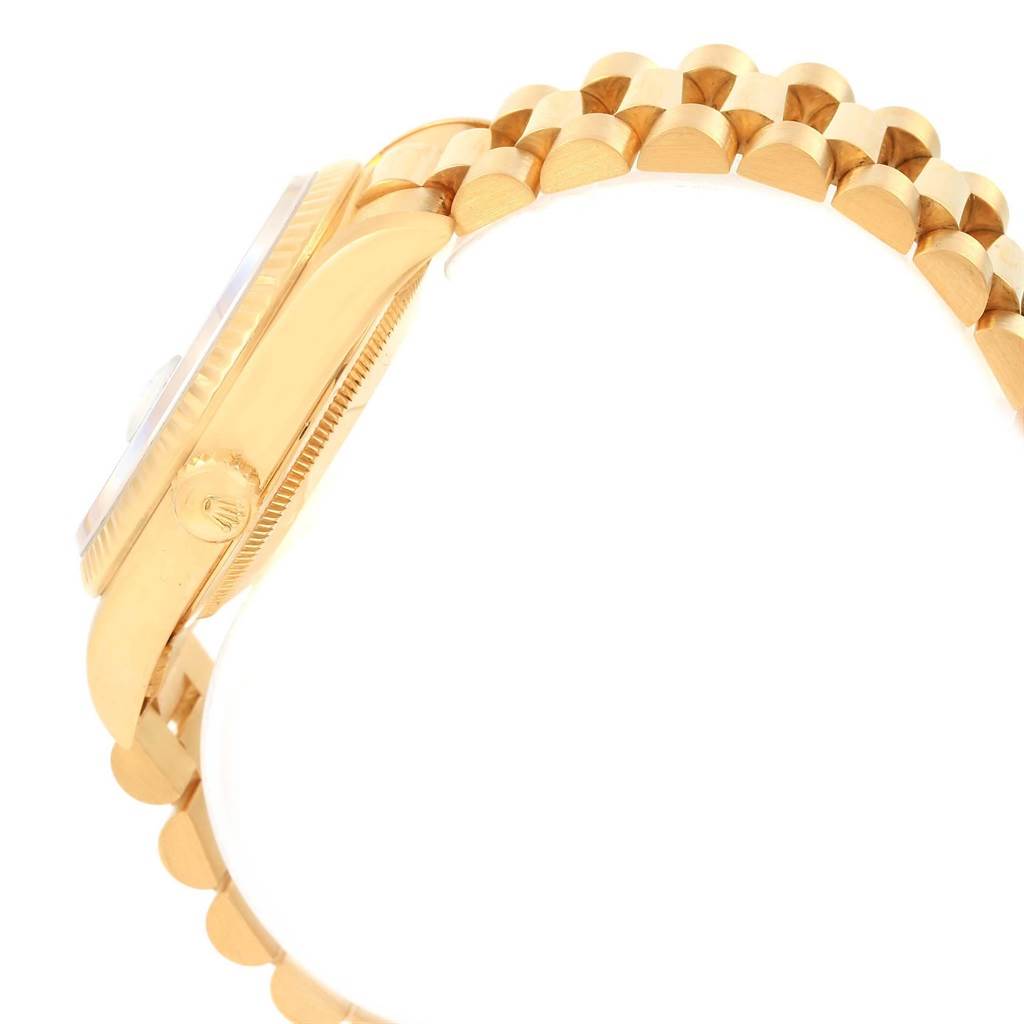 The image shows a side view of the Rolex President 18238 Men
s Yellow Gold White Dial 18238 Men
s Yellow Gold White Dial model watch, focusing on its gold case, crown, and the bracelet.