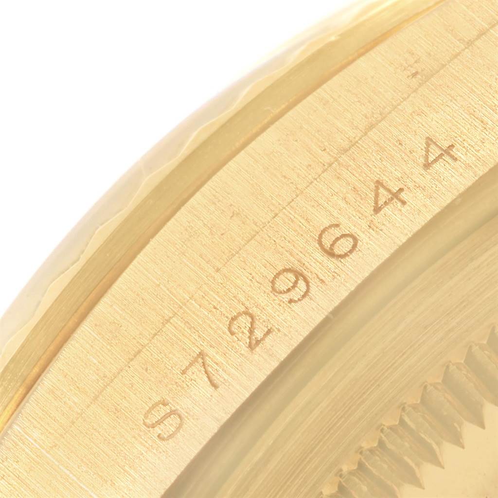 The image shows a close-up of the side view of the bezel with serial numbers on a Rolex President 18238 Men
s Yellow Gold Champagne Dial 18238 Men
s Yellow Gold Champagne Dial model watch.