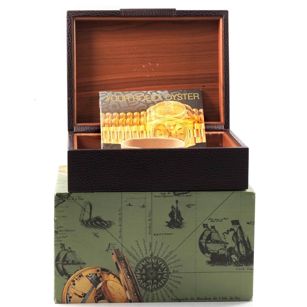 The image shows an open packaging box with a booklet for the Rolex President 18238 Men
s Yellow Gold Champagne Dial 18238 Men
s Yellow Gold Champagne Dial model watch.