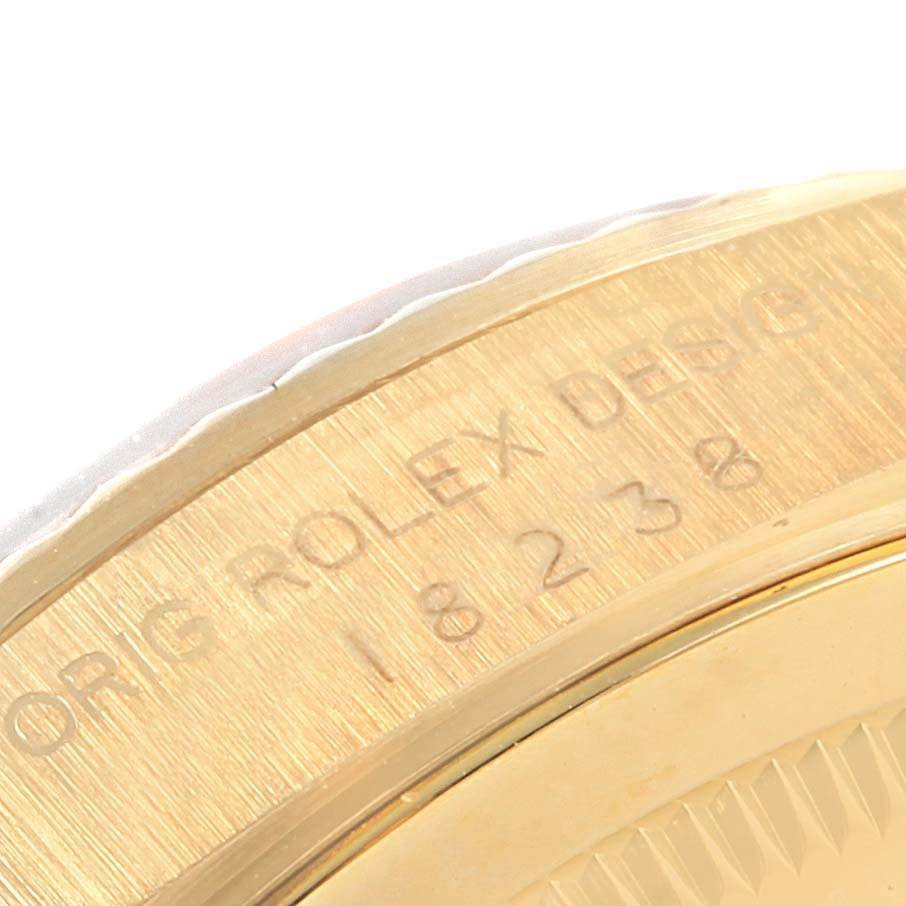 The image shows a close-up of the side of the Rolex President 18238 Men
s Yellow Gold Champagne Dial 18238 Men
s Yellow Gold Champagne Dial model, highlighting the engraving on the gold surface.