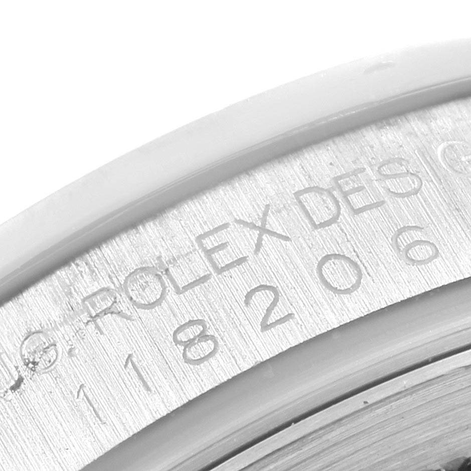 This is a close-up angle showing the engraved model number on the case of a Rolex President 118206 Men's Platinum Blue Dial 118206 Men's Platinum Blue Dial watch.