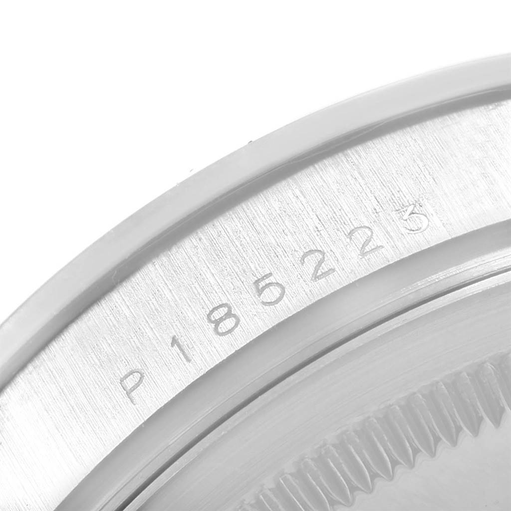 This image shows a close-up of the caseback and serial number of a Rolex President 118206 Men's Platinum Blue Dial 118206 Men's Platinum Blue Dial model.