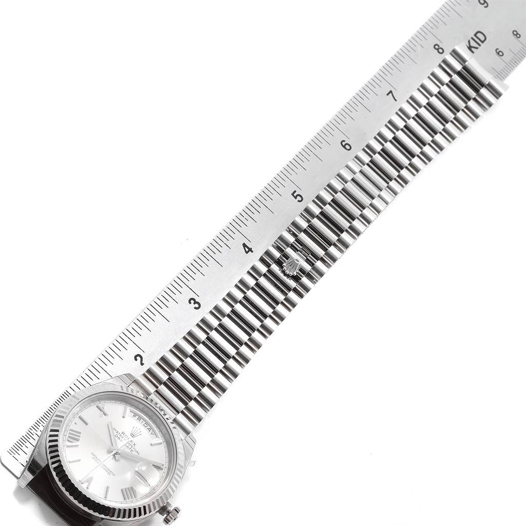 The image shows the face and bracelet of the Rolex President 228239 Men's White Gold Silver Dial 228239 Men's White Gold Silver Dial watch, alongside a ruler for size reference.