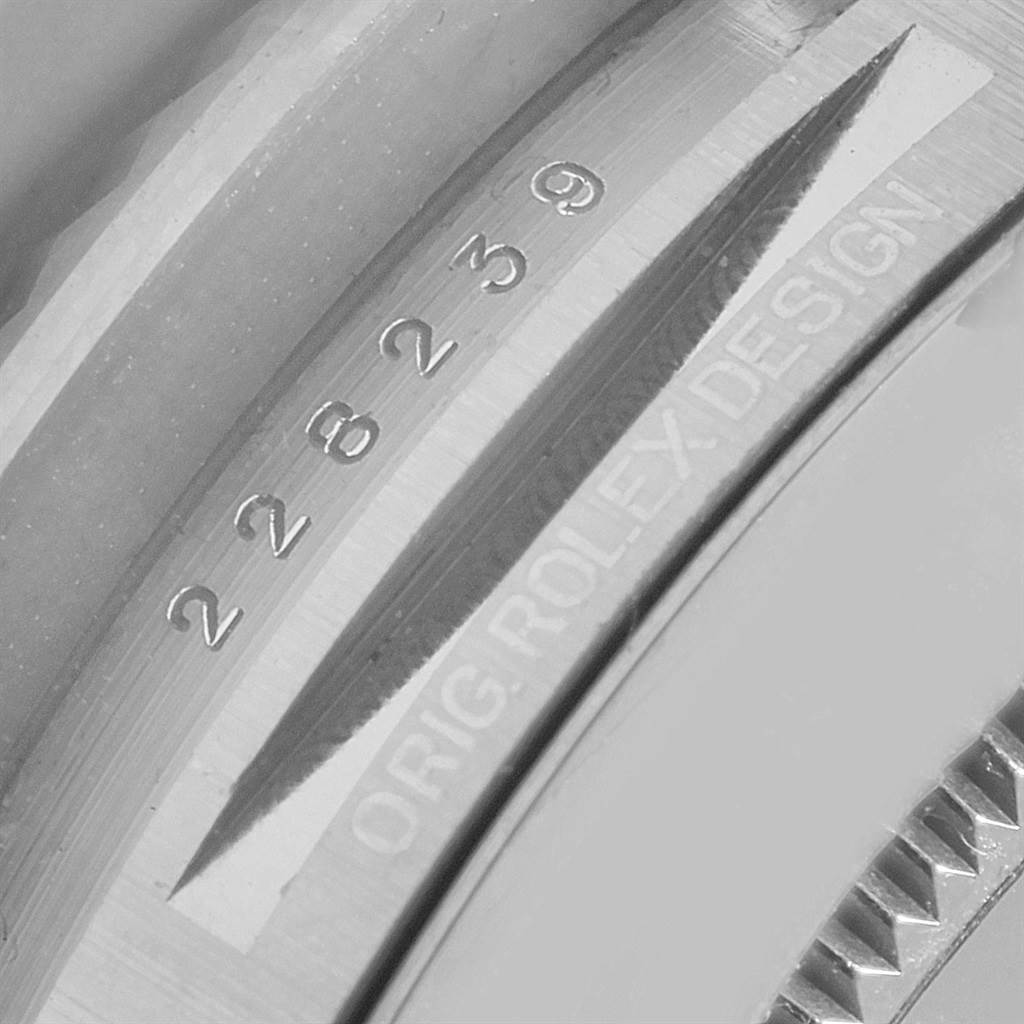 The image shows a close-up of the Rolex President 228239 Men's White Gold Silver Dial 228239 Men's White Gold Silver Dial model, focusing on the serial number and the words "ORIG.ROLEXDESIGN."