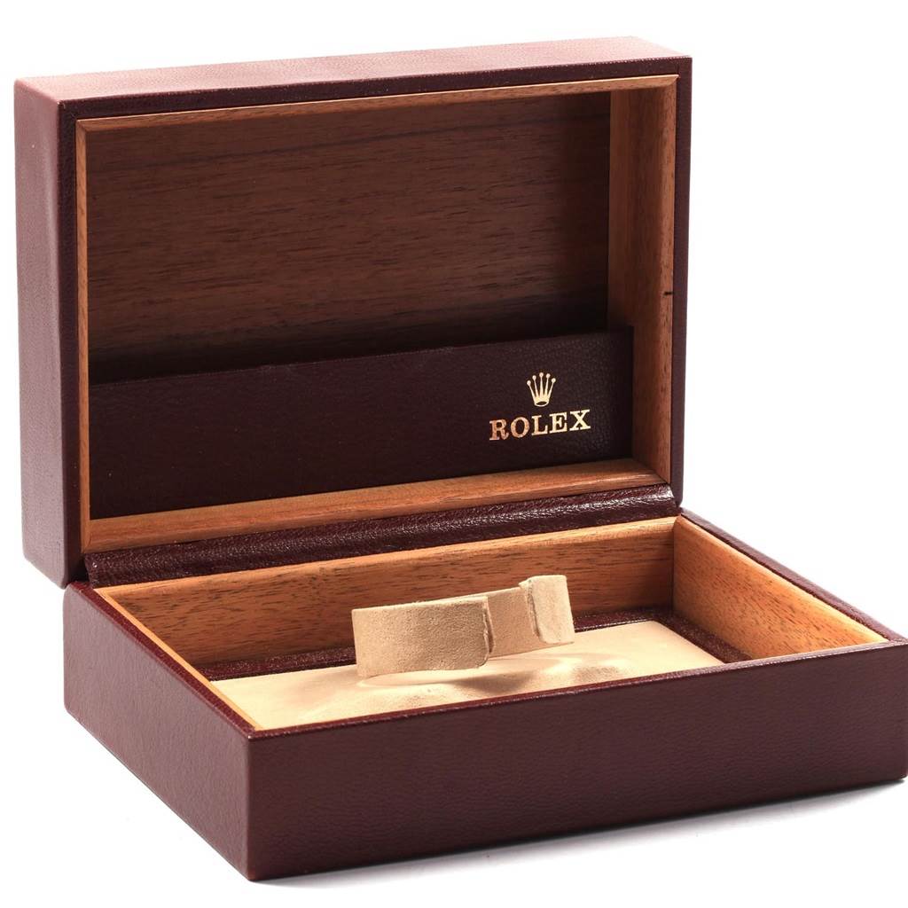 This image shows an open Rolex President 18078 Men
s Yellow Gold Champagne Dial 18078 Men
s Yellow Gold Champagne Dial model watch box, in a burgundy and wood finish, without the watch inside.