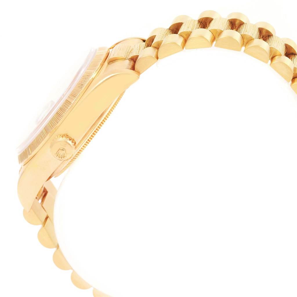 The image shows a side view of a Rolex President 18078 Men
s Yellow Gold Champagne Dial 18078 Men
s Yellow Gold Champagne Dial model watch highlighting the crown and bracelet.