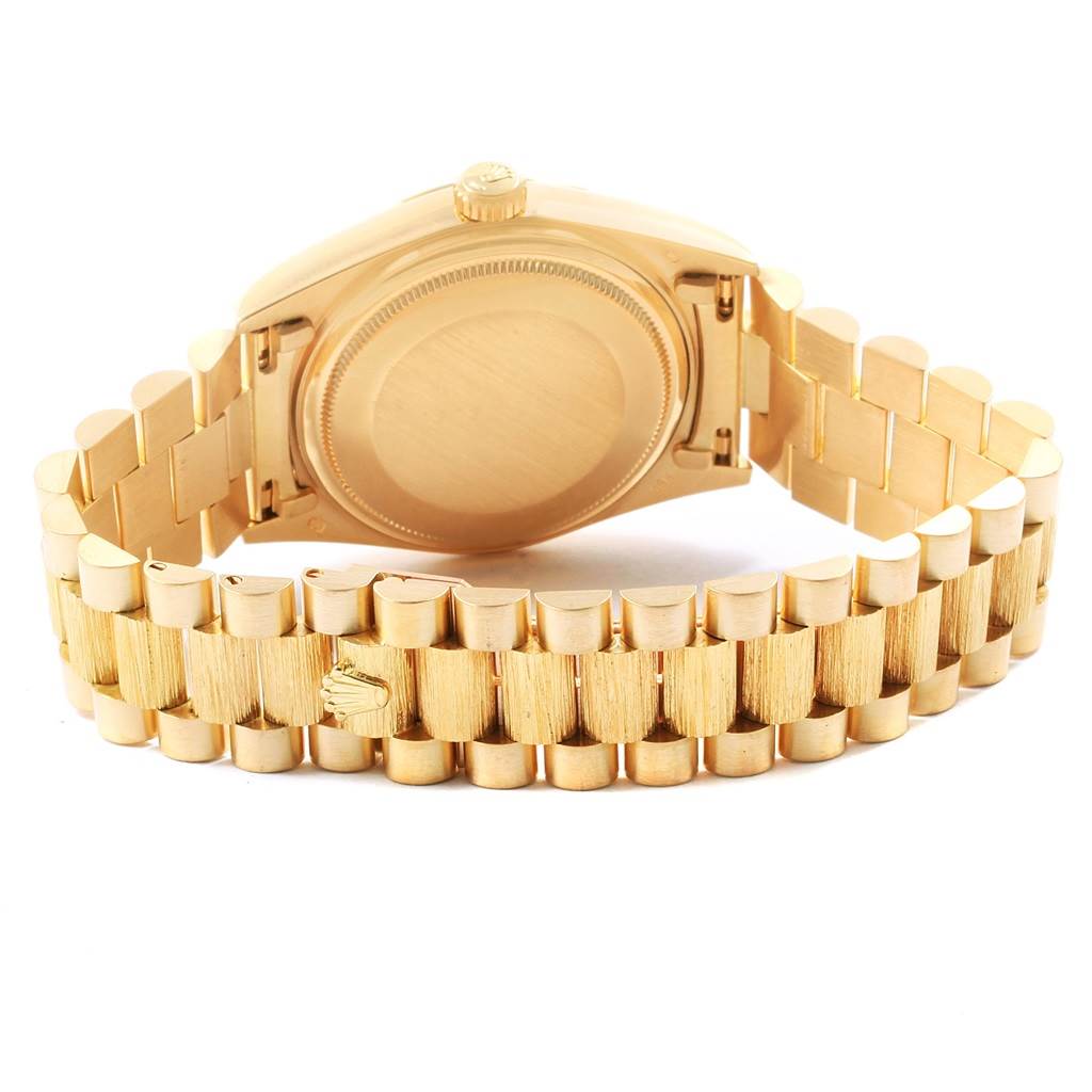The image shows the back case and the bracelet of a Rolex President 18078 Men
s Yellow Gold Champagne Dial 18078 Men
s Yellow Gold Champagne Dial model watch from a rear angle.