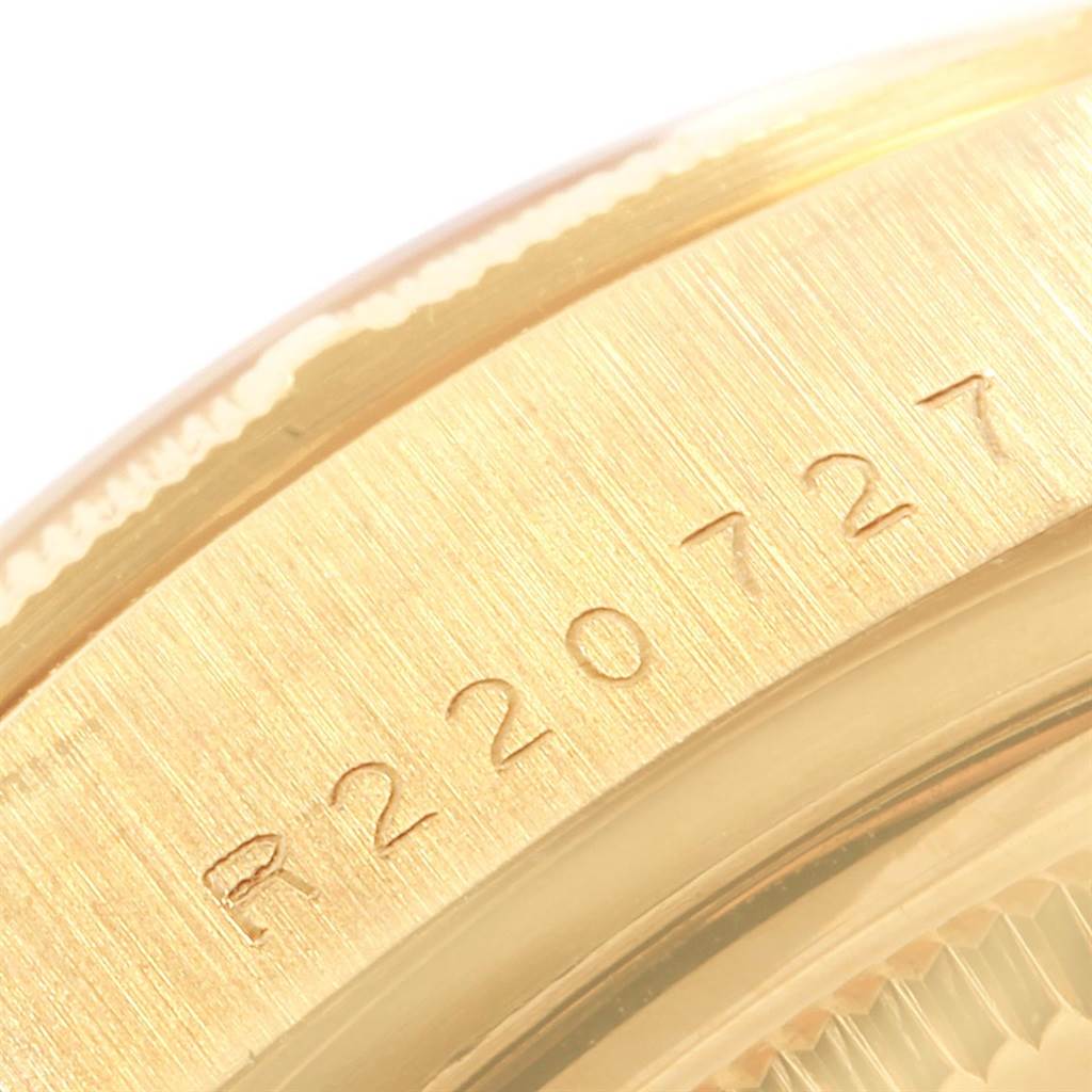 The image shows a close-up of the serial number engraving on the case of a Rolex President 18078 Men
s Yellow Gold Champagne Dial 18078 Men
s Yellow Gold Champagne Dial model watch.