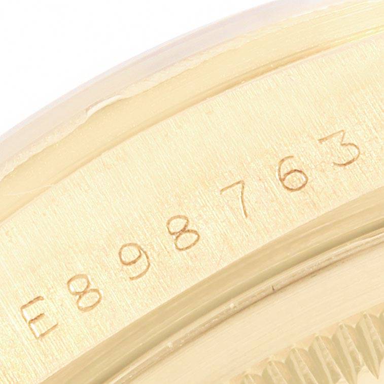The image shows a close-up of the serial number on the case side of a Rolex President 18248 Men
s Yellow Gold Champagne Dial 18248 Men
s Yellow Gold Champagne Dial model watch.