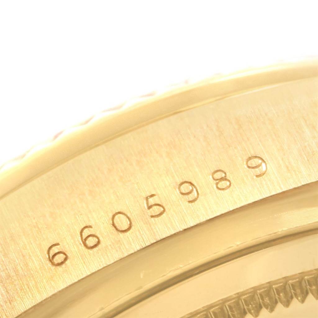 This image shows a close-up angle of the Rolex President 18038 Men
s Yellow Gold Champagne Dial 18038 Men
s Yellow Gold Champagne Dial model, focusing on the serial number engraved on the case.