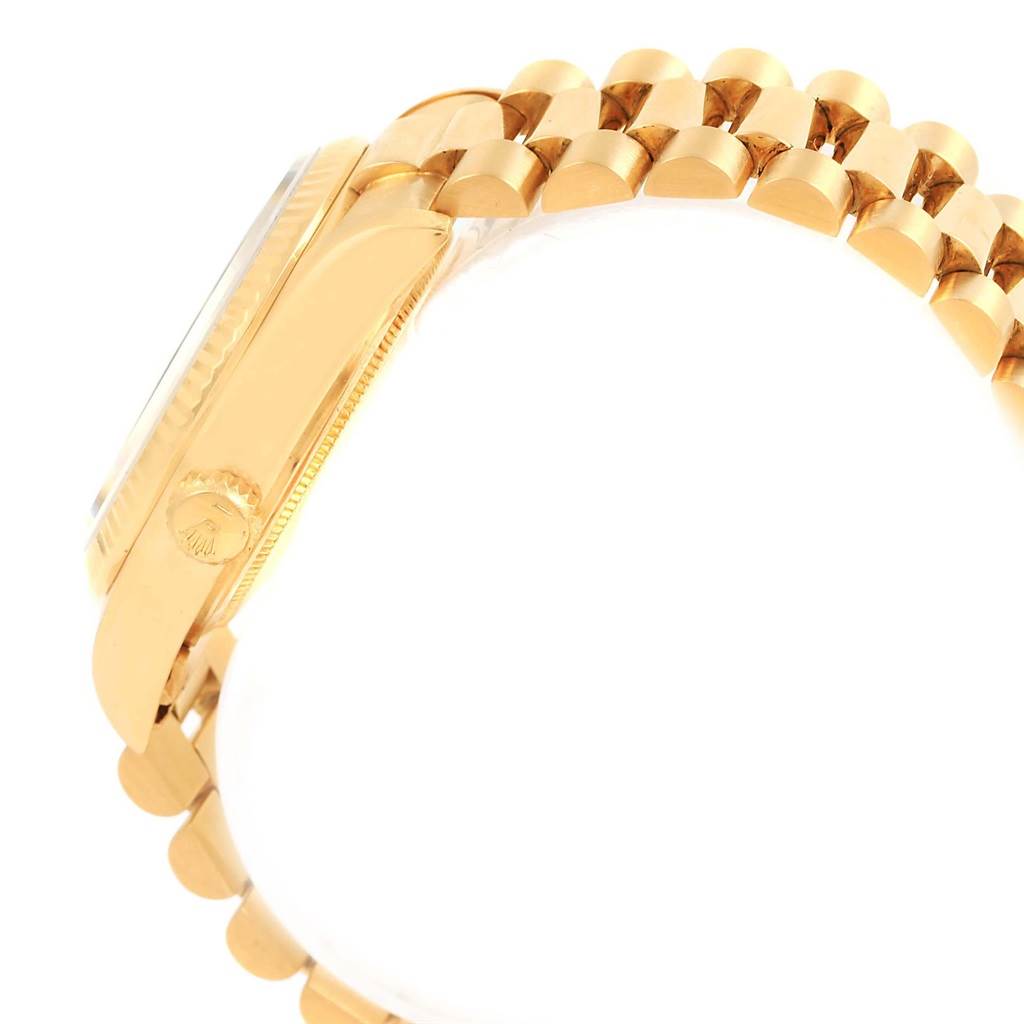 The image shows the side view of a Rolex President 18038 Men
s Yellow Gold Champagne Dial 18038 Men
s Yellow Gold Champagne Dial model watch, highlighting its crown and part of the bracelet.